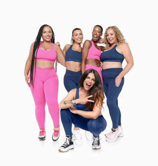 A group of inclusive women in pink and blue women's athleisure wear, plus size, leggings and sports bra
