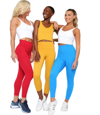inclusive group of women all smiling in their Fitkitty Culture  women's athleisure wear with rainbow background