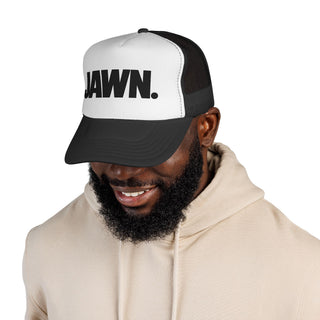 Man wearing the black-and-white JAWN. trucker hat