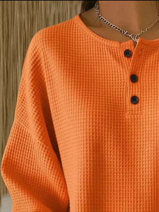 Waffle knit top with button detail, texture close-up