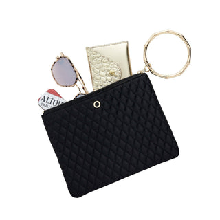 Black quilted Big O bracelet pouch filled with a phone, wallet, and sunglasses