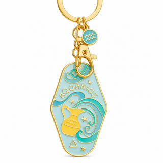 An Aquarius-themed keychain charm with a gold-plated metal frame and clasp, featuring light blue enamel and gold details, including the Aquarius zodiac symbol, a pitcher, stars, and the word 'AQUARIUS'.