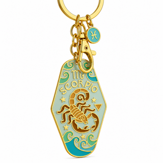 Gold-tone metal keychain featuring an 'My Scorpio' coffin-shaped charm with a gold scorpion design and turquoise enamel details, shown on a plain white background.
