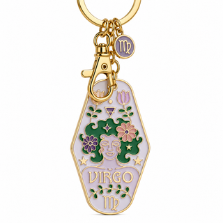 Gold-tone metal keychain featuring a coffin-shaped charm with an enamel Virgo zodiac design, including a face, flowers, stars, and the word 'Virgo', attached to a gold split ring and clasp.