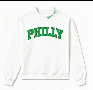 White PHILLY mockneck sweatshirt with green varsity lettering and green BIRDS 1933 collar embroidery.
