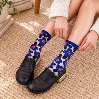 Bold Blue Floral Sheer Crew Sock styled in a warm neutral House of Caelo setting