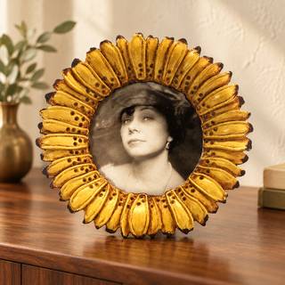 Golden calendula sunflower round photo frame on a warm styled console