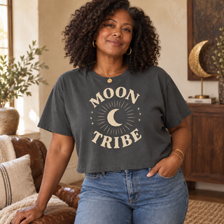 Curly-haired woman wearing the Pepper gray Cozy Moon Tribe cropped boxy tee with high-rise denim