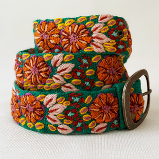 Colorful floral embroidered belt on a white background