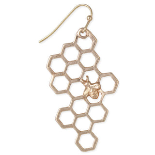 Close-up of one gold-tone open honeycomb earring with a tiny bee accent