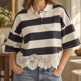 Close view of the striped polo collar, button placket and scalloped ivory lace hem