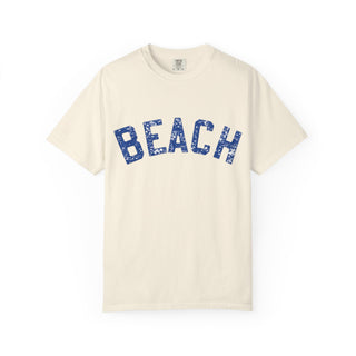 off-white t-shirt with 'BEACH' printed in blue on a white background