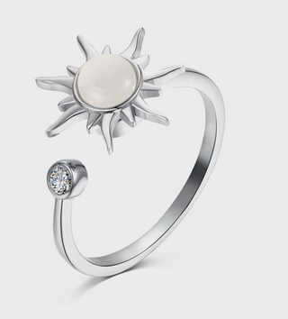 Silver Solstice Spinner Ring with pearl-look sun center and crystal accent