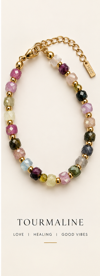 Stone Stack Tourmaline faceted gemstone and gold beaded bracelet on a luxe cream background