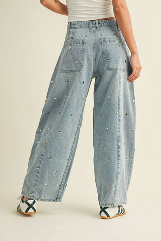 Women’s light-wash statement denim with barrel leg shape and subtle stud embellishment